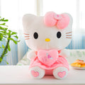 Licensed Sanrio Hello Kitty Plush Doll - Pink & White Kitten with Hugging Heart, Soft Cuddly KT Cat Toy, Officially Licensed Collectible Stuffed Animal, & s, Cute Gift (White Face & Pink Outfit)